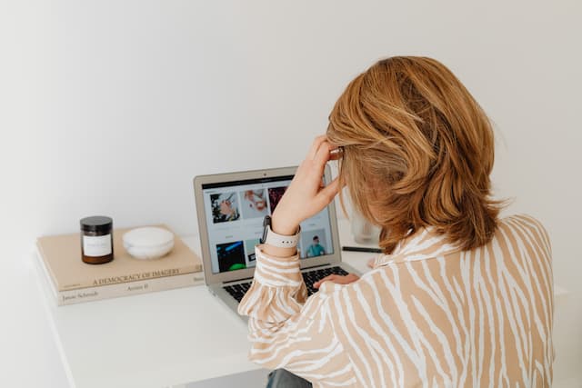 A woman works at her desk - home office